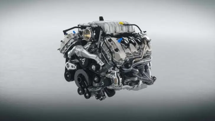 Mustang GTD engine isolated on a reflective surface, highlighting mechanical components.